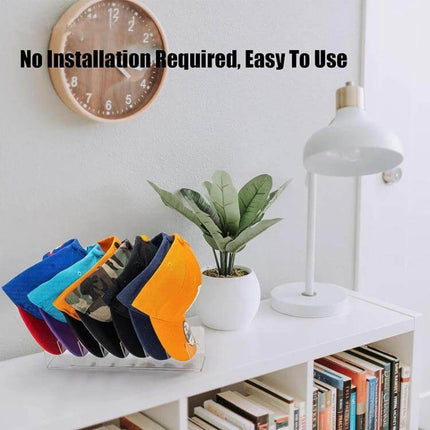 Acrylic Baseball Cap Holder Stores 7 Caps For Easy Countertop Organization - transparent acrylic rack holding seven colorful caps on a desk
