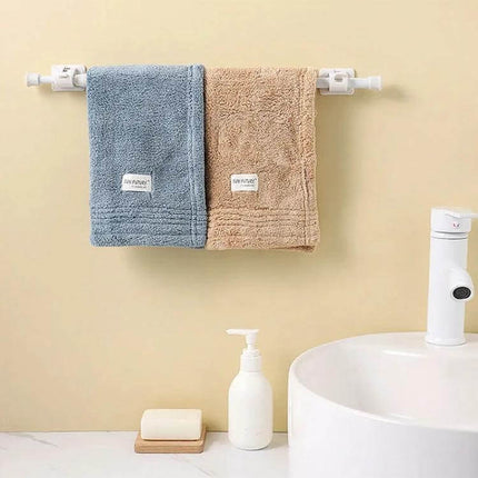 Curtain Telescopic Rod Hooks Adjustable 30-110cm Set holding two towels in a bathroom, tool-free adjustable tension rod for renters and temporary setups