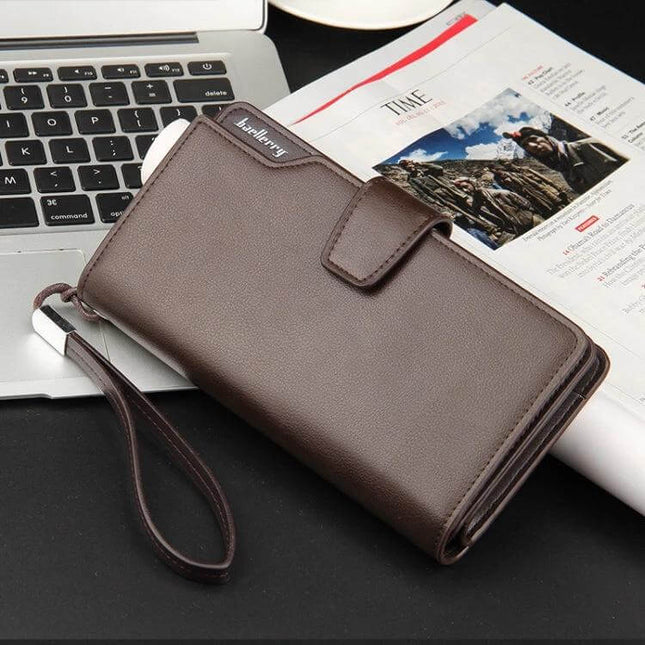 Baellerry Long Clutch Wallet for Men Brown Tri Fold Phone Bag shown on table with wrist strap, zipper, and PU leather texture