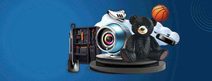 Collection of gifts and gadgets: camera lens, tool kit, teddy bear, basketball and headphones on display