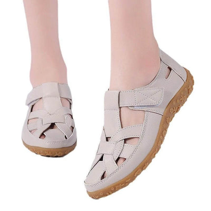 Beach Hollowed Flat Sandals For Casual Summer Wear - light beige hollowed flat sandals with Velcro closure, patent-style upper and non-slip gum sole for beach and travel