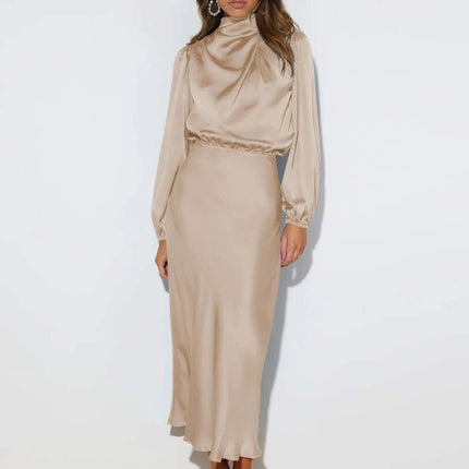 Satin Halterneck Mid Length Dress With Long Sleeves For Evening in champagne satin with halter neckline, lantern sleeves and stitched patchwork skirt