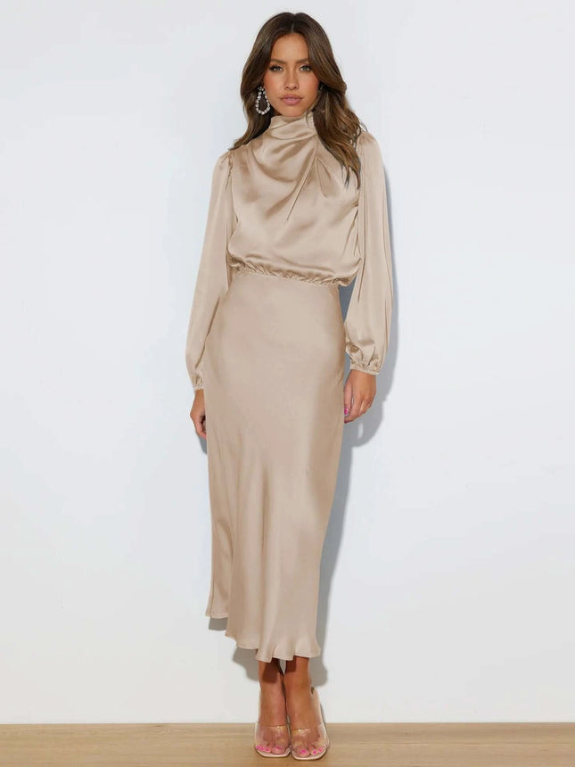 Satin Halterneck Mid Length Dress With Long Sleeves For Evening in champagne satin with halter neckline, lantern sleeves and stitched patchwork skirt