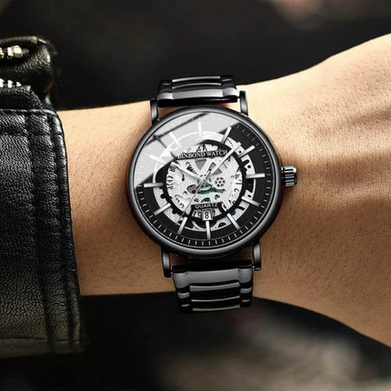 BINBOND Multifunctional Luminous Waterproof 44mm Mens Wrist Watch on wrist with black metal strap, skeleton dial, date display and luminous hands