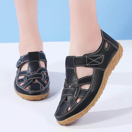 Beach Hollowed Flat Sandals For Casual Summer Wear – black patent-style leather low-top sandals with Velcro closure, round toe and quick-dry hollowed design
