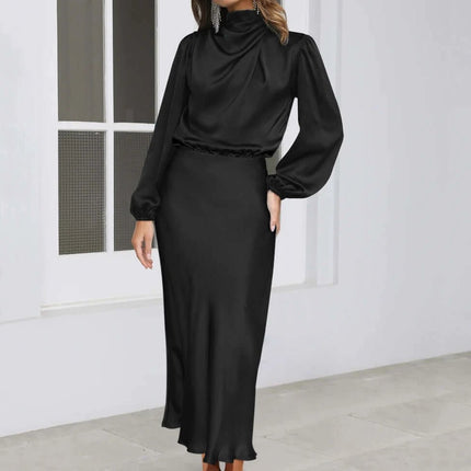 Satin Halterneck Mid Length Dress With Long Sleeves For Evening in black matte satin with lantern sleeves and stitched patchwork mid-length skirt