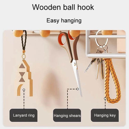 Black Wall Hanging Organizer Shelf for Everyday Use with wooden ball hooks holding keys, scissors and lanyard in entryway