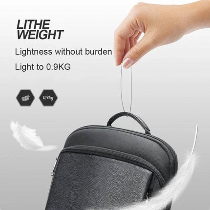 Bopai First-Layer Cowhide Laptop Backpack Waterproof For Business Commute showing lightweight 0.9kg design held by hand, textured cowhide and top handle