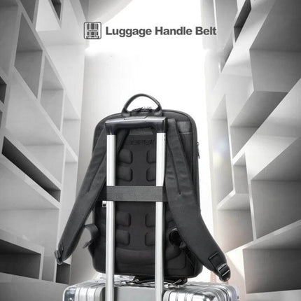 Bopai First-Layer Cowhide Laptop Backpack Waterproof For Business Commute shown mounted on suitcase with luggage handle belt for travel