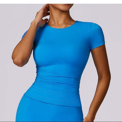 Breathable Tight Yoga Short Sleeve T Shirt For Running And Fitness in fitted blue nylon tee showing moisture-wicking, hip-length cut and unrestricted arm movement