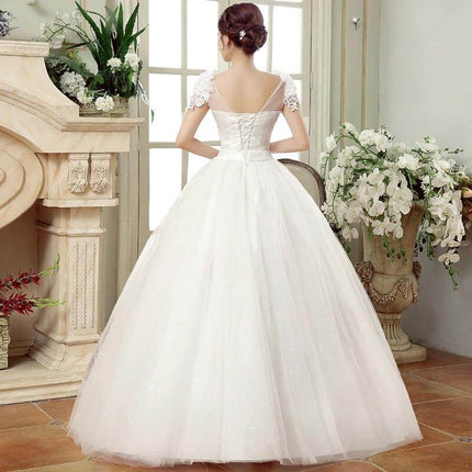 Bridal Gauze Dress With Lace Shoulder Detail For Wedding Day shown from back with airy gauze skirt and delicate lace shoulder accents
