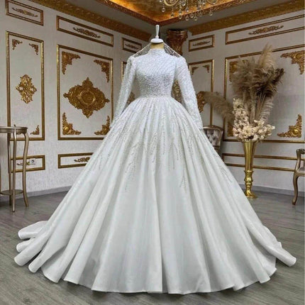 Bride Owner White Wedding Pettiskirt for Bridal Look on mannequin in ornate room, high-waist long-sleeve elegant bridal gown