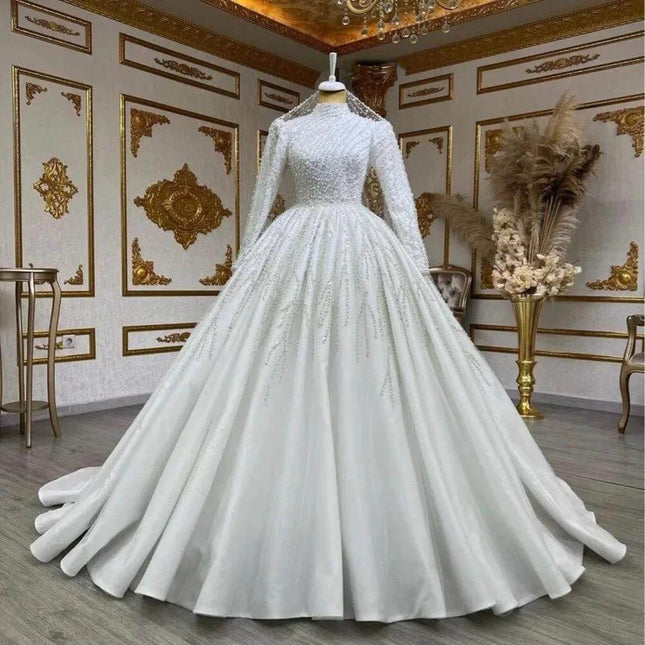 Bride Owner White Wedding Pettiskirt for Bridal Look displayed on mannequin in ornate room, high-waist long-sleeve elegant bridal gown