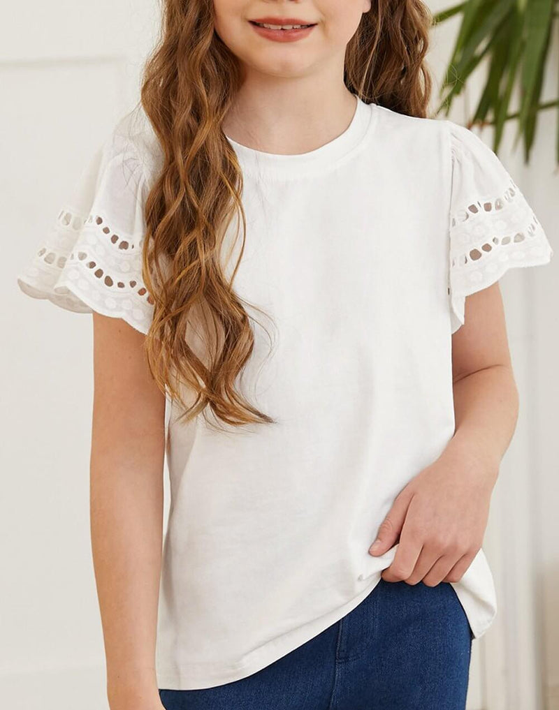 Woman wearing a white round neck flutter sleeve t-shirt with chic eyelet design, showcasing casual elegance and comfort.