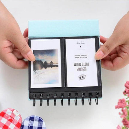 Calendar Style Desktop Standing Folder Album 68 Photos showing open vertical desk album with two photos and spiral stand