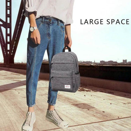 Canvas Laptop Backpack For 13-15 Inch Laptops Everyday Use - casual grey canvas backpack held by person, large space, dedicated laptop compartment