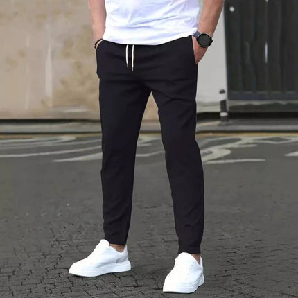 Casual Cropped Straight Pants For Leisure In Solid Black shown on model with white sneakers for casual everyday and office-casual wear