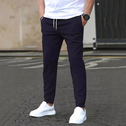 Casual Cropped Straight Pants For Leisure In Solid Black shown on model with white sneakers, cropped above ankle for modern everyday leisure look