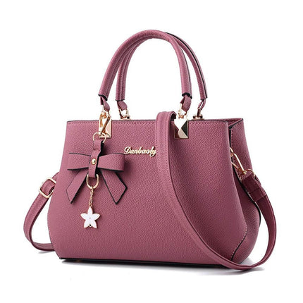 Casual One-Shoulder Litchi Pattern Diagonal Handbag in mauve PU with litchi texture, zipper closure, bow charm and detachable crossbody strap