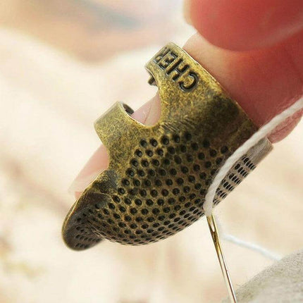 Sewing Thimble Finger Protector for Everyday Sewing Small copper thimble fingertip guard used for hand sewing, quilting, mending with needle control