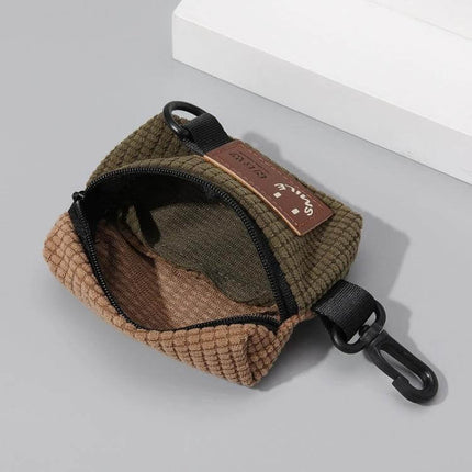 Corduroy Hanging Bag for Earphones Everyday Cycling Accessory compact corduroy organizer with keychain clip open showing interior cables