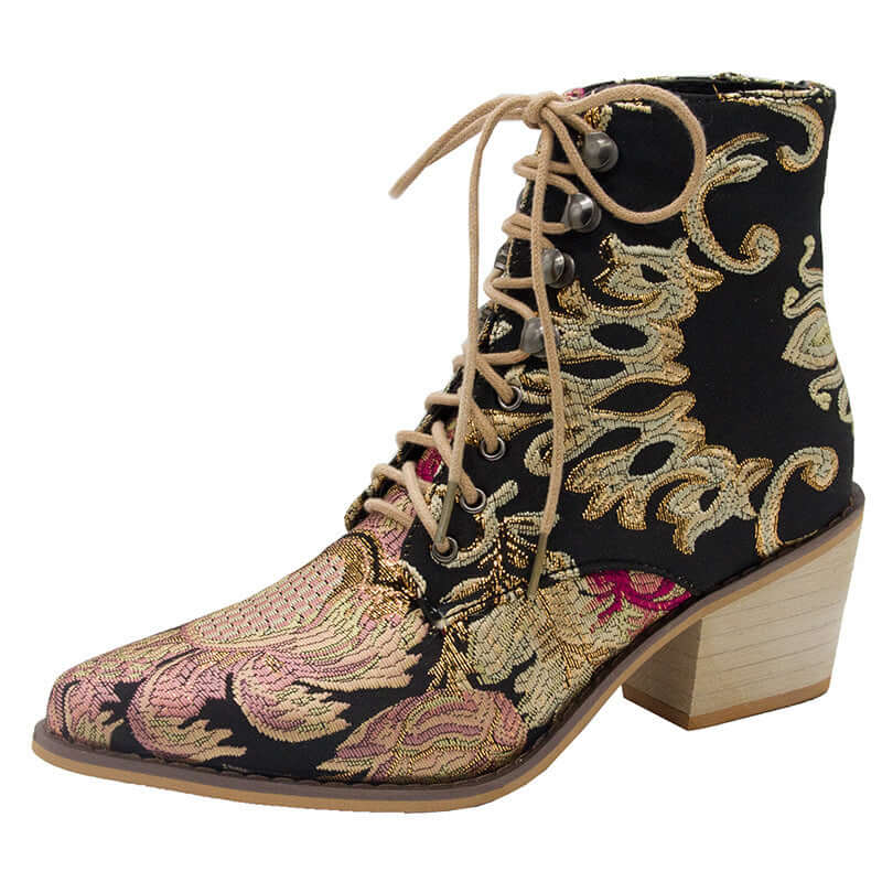 Black embroidered satin ankle boots with high chunky heels and intricate ethnic designs, featuring tan laces and a beige wooden heel.