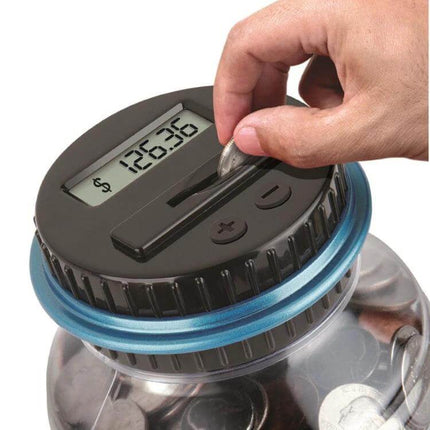 Digital Counting Money Coin Bank For Kids Counts USD EUR GBP showing hand inserting coin into digital jar with visible total on display