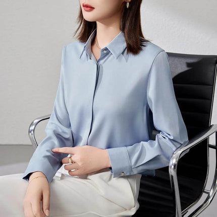 Elegant Satin Long Sleeve Top for Women's Office Wear - light blue satin shirt sleeve top with stitch button detail, styled with white pants for professional office look