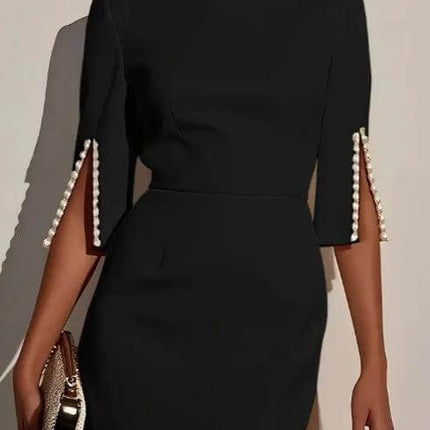 Elegant Pearl Accent Dress With Slit Sleeves For Everyday Wear — black polyester sheath dress with pearl‑trim slit sleeves, styled with clutch