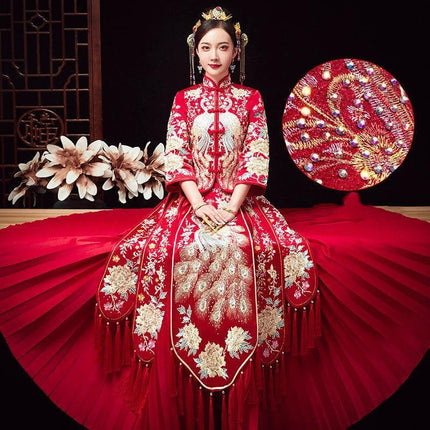 Embroidered Cheongsam Dress For Chinese Wedding Couples in red with intricate gold embroidery, pleated skirt, and traditional seven-point sleeves