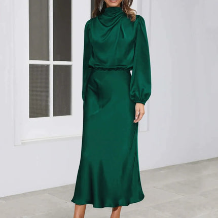 Satin Halterneck Mid Length Dress With Long Sleeves For Evening in emerald satin with draped halter neckline, lantern sleeves and mid-length skirt
