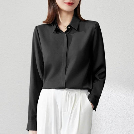 Elegant Satin Long Sleeve Top for Women's Office Wear in black satin with stitch button detail, styled with white trousers for professional look