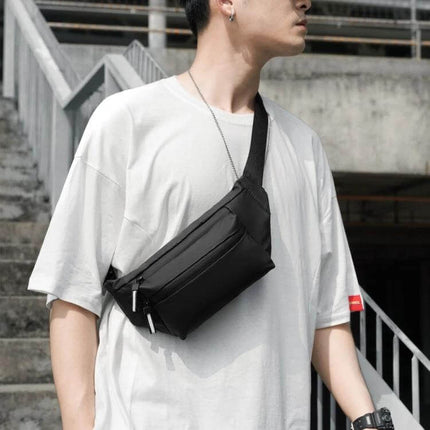 Feihadun Adjustable Oxford Cloth Waist Bag Black For Everyday Use worn crossbody on model, compact multi-compartment black waist bag for commuting