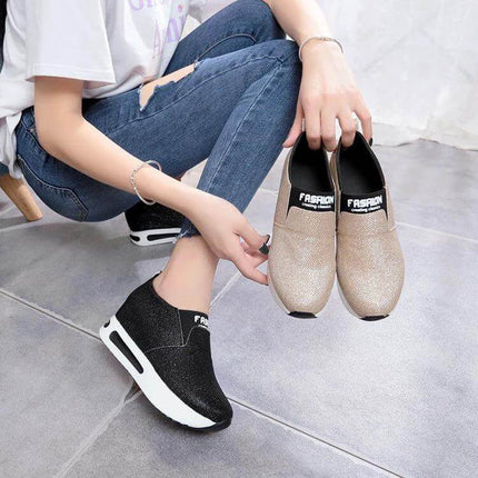 Flat PU Leather Womens Sneakers For Everyday Casual Wear shown in black and gold slip-on low-profile design with rubber sole and visible stitching
