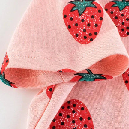 Girls Strawberry Short Sleeve Cotton T Shirt For Everyday Summer Wear featuring pink fabric with printed red strawberry pattern, soft 100% cotton close-up