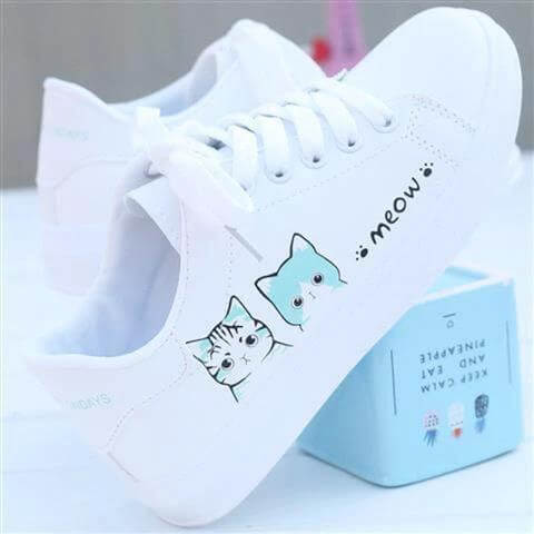 Girls Casual Leather Sneakers Flat Rubber Sole For Everyday white low-profile leather sneakers with cute cat print and "meow" text, flat rubber sole