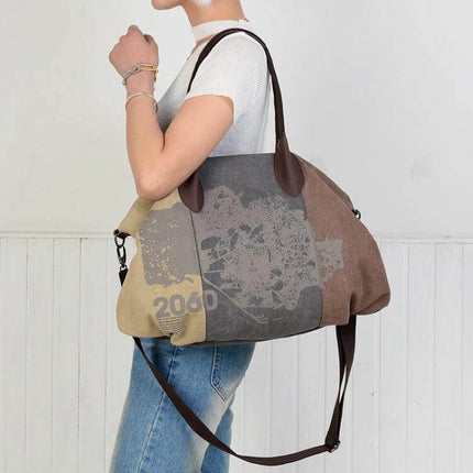 Graffiti Print Canvas Messenger Bag For Everyday Use Large Capacity shown worn over shoulder with large graffiti print and travel-ready pockets