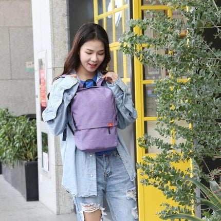 HAWEEL 10L Chest Pack For Everyday Use And Travel shown on model wearing a compact water-resistant purple chest bag for city commuting