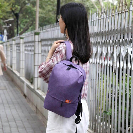 HAWEEL 10L Chest Pack For Everyday Use And Travel worn by woman walking in city, compact water-resistant chest bag for hands-free travel