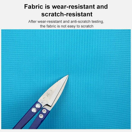 HAWEEL Hiking Backpack Large Capacity For Outdoor Use showing tear- and water-resistant turquoise fabric with scissors testing scratch resistance