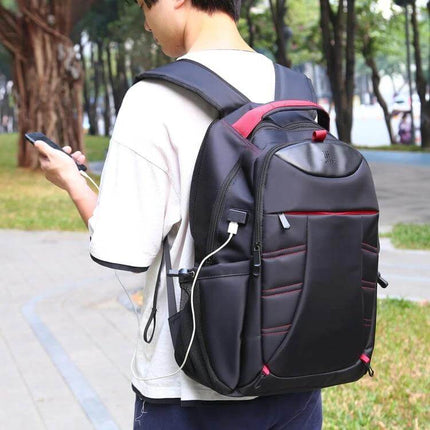 HAWEEL Laptop Backpack With Foldable Design For Daily Use on a student walking outdoors showing USB charging port and padded laptop compartment
