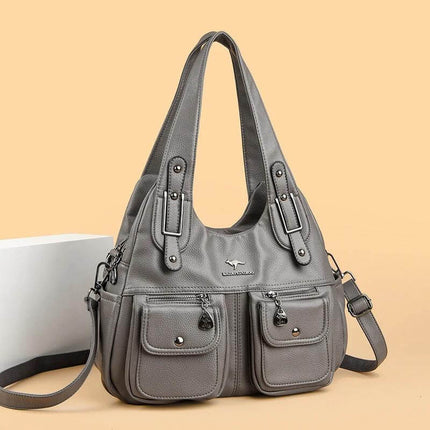 Heart Shaped PU Crossbody Handbag For Everyday Carry gray PU handbag with stitched detailing, dual front pockets and three strap options for daily essentials