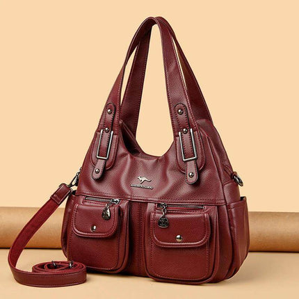 Heart Shaped PU Crossbody Handbag For Everyday Carry in red PU with stitched detailing, three straps and front pockets for phone wallet keys cosmetics