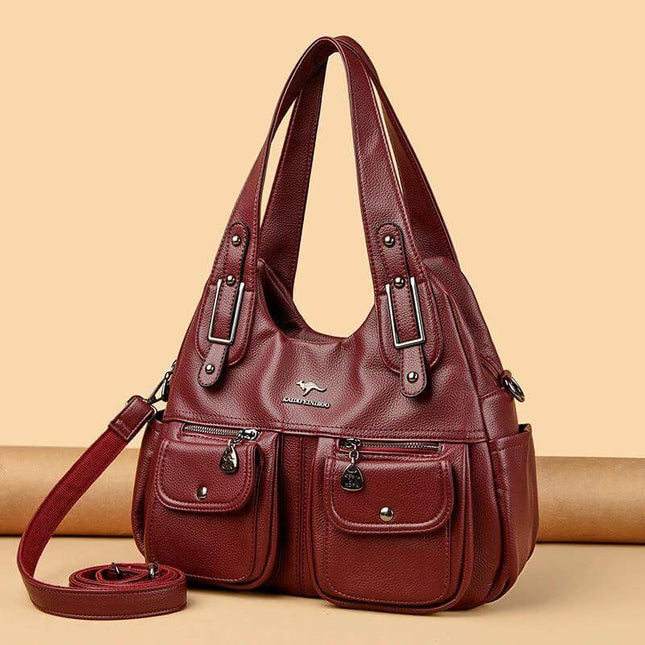 Heart Shaped PU Crossbody Handbag For Everyday Carry in red PU with stitched detailing, three straps and front pockets for phone wallet keys cosmetics