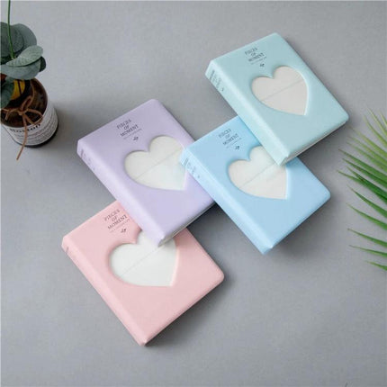 Hollow Heart 64 Pockets Photo Album for Instax Mini Sky Blue - compact sky blue PVC cover with hollow heart window, holds 64 Instax Mini photos