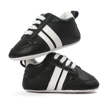 Infant Soft Moccasin Shoes Non Slip Newborn First Walkers - black leather-look soft moccasins with white stripes, cushioned interior and textured non-slip sole
