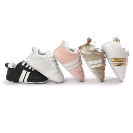 Infant Soft Moccasin Shoes Non Slip Newborn First Walkers - row of black, white, pink, gold and white baby moccasins with flexible non-slip soles for first steps