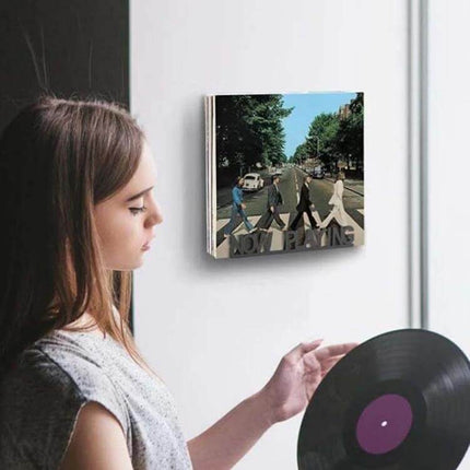 Vinyl Record Storage Wall Mounted Display Rack Iron holding a vinyl record on a living room wall, compact 25x25x6cm iron design