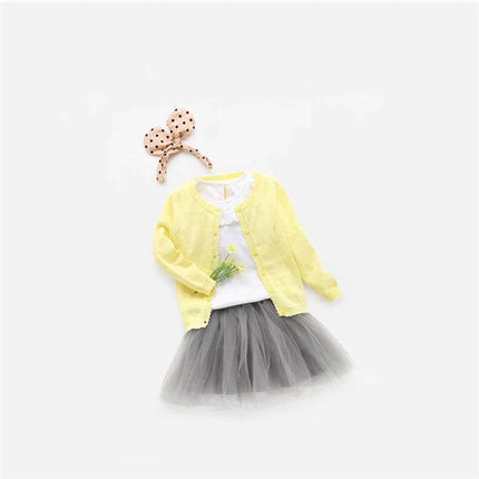 Knitwear Baby Cardigan With Diagonal Tie Closure For Everyday Wear - yellow knit cardigan styled with white top, grey tulle skirt and polka dot headband