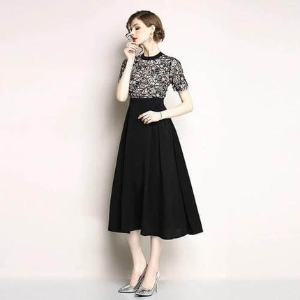Lace Short Sleeve Mid Length Swing Dress for Everyday Casual Wear in black with geometric embroidered lace bodice and flowing swing skirt